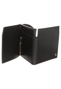 Black leather bi-fold wallet open showing stitched edges and metal money clip inside.