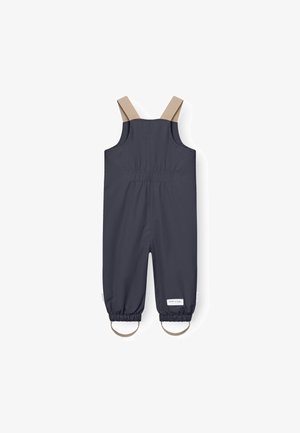 Donkergrijze waterdichte overall met beige banden, elastische manchetten en een geplooide achterkant voor een verstelbare pasvorm. Minimalistisch ontwerp met logo-detail.