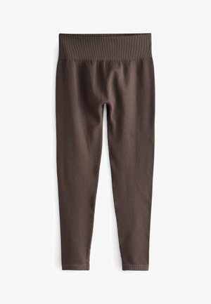 Leggings a coste marroni con una cintura elastica larga. Il tessuto è liscio ed elasticizzato, offrendo una vestibilità aderente lungo le gambe.