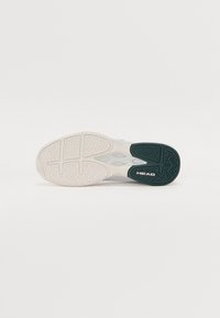 Tennis sko sål med en tekstureret hvid gummibase og mørkegrønne accenter. Har et mønstret greb og branding på siden.