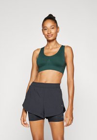 ONLY Play ONPMIRA SEAMLESS BRA OPUS - Sutiã desportivo de suporte ligeiro - scarab