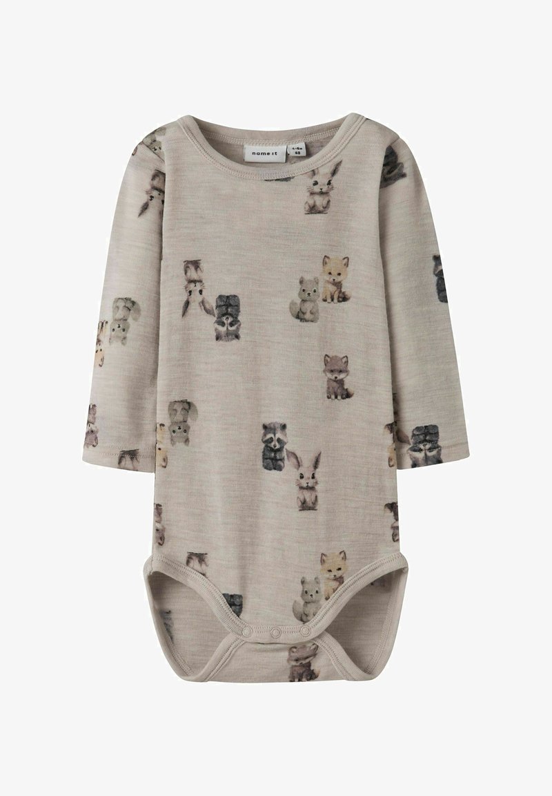 Dětská bodý s dlouhým rukávem v měkké béžové látce s potiskem zvířat. Má klasický výstřih a zapínání na patentky na spodní části pro snadné oblékání.