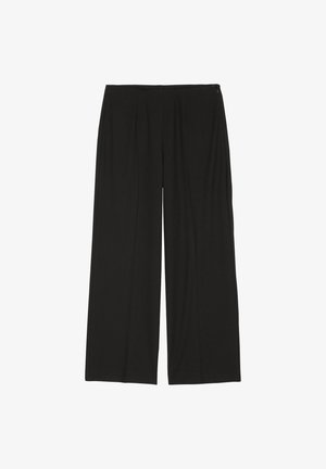 Schwarze, weit geschnittene Hose aus weichem Stoff. Sie hat ein gepunktetes Design mit einem seitlichen Reißverschluss. Glatte Textur und knöchellanger Schnitt.