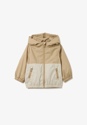 Beige en crème tweekleurige windbreaker jas, met een capuchon, elastische manchetten, een volledige ritssluiting en twee zijzakken met ritssluiting.