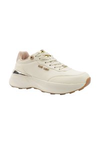 Cream-colored sneaker with thick sole, gold metallic accents, lace-up front, and "Nine West" branding on the side.