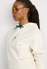 The North Face COORDINATES CROP HOODIE - Športni pulover - white dune