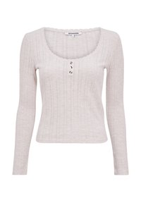 Top a maniche lunghe di un leggero beige a coste con scollatura a onda e tre bottoni sul davanti. Tessuto morbido con una silhouette aderente.