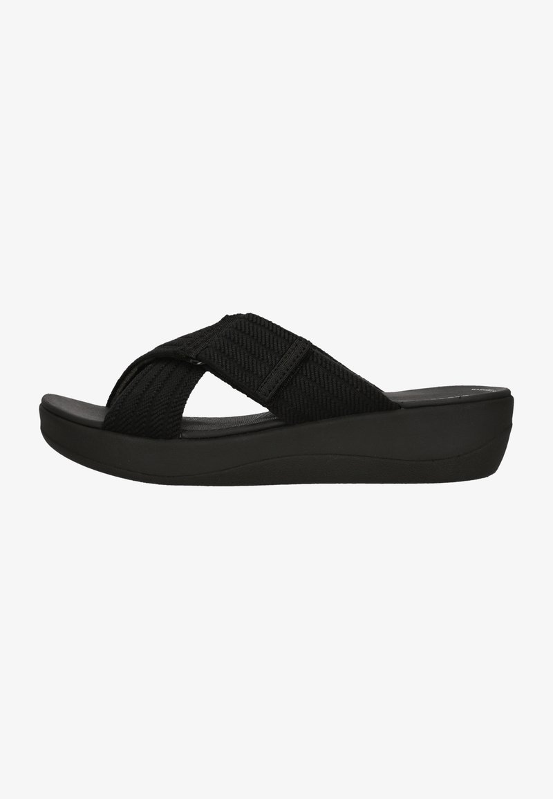 Svart flip-flop sandal med vävda tygremmar, plattformssula och böjd design. Har en texturerad rem för extra grepp.