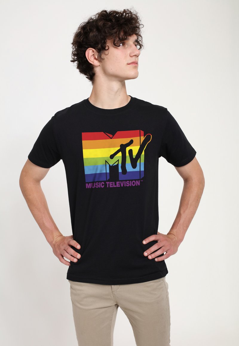 Black cotton t-shirt featuring a multicolored MTV logo with red, yellow, green, and blue stripes and the text "MUSIC TELEVISION" in purple.