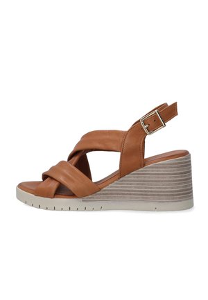 Brown leather wedge sandal with crossover straps, adjustable buckle, and a textured light brown platform sole.