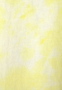 Tela de atado amarillo con textura suave. Diferentes tonos de amarillo y crema crean un patrón mezclado en la superficie.