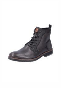 Bota de cuero negra con lados texturizados, puntera redonda, cordones y una etiqueta de cuero marrón. Suela de goma para mayor tracción.