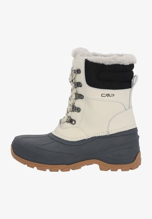 Bottines imperméables blanches et noires avec bord en fourrure, semelle en caoutchouc et design à lacets, présentant une surface texturée et une semelle extérieure contrastante en brun.