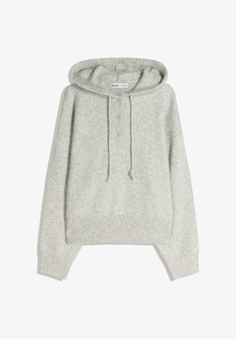 Jasnoszara bluza z kapturem o miękkiej fakturze, kieszenią kangurką, plisą z trzema guzikami oraz ściągaczami przy rękawach i na dole. Zaprojektowana dla luźnego kroju.