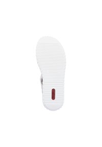 White rubber shoe sole with a textured surface, ridges for grip, and a central logo in red. Scalloped edges provide a finished look.