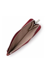 Red zippered wallet with a fabric exterior. Lined interior features a light tan color. Metal zipper and pull tab visible. Compact design.