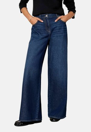 Weite blaue Denim-Jeans mit Knopfverschluss, zwei vorderen Taschen und einem sauberen Finish. Mit geradem Schnitt, der bis zu den Knöcheln reicht.