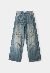 Wide-leg denim jeans in faded blue with large, stitched diamond patches, frayed edges, and traditional five-pocket design.
