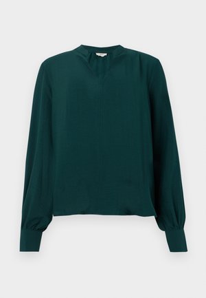 Tirkizna bluzica dugih rukava s V-izrezom, nabranim manžetama i ležernim krojem. Glatka tekstura s suptilnim sjajem, bez vidljivih uzoraka ili ukrasa.