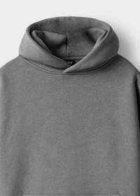Gray hoodie made of soft fabric, featuring a large, snug hood and a front pocket. Smooth texture with minimal stitching details.