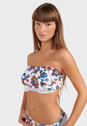 Multicolored bandeau bikini top with a ruffled bottom edge, featuring a white base and vibrant abstract patterns in blue, red, and green.