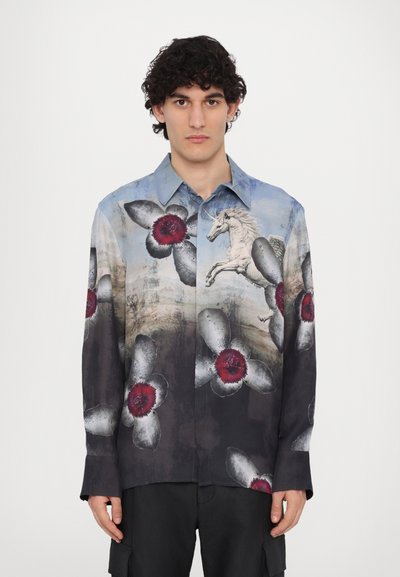 Collared long-sleeve shirt in light blue, featuring large dark flowers with red centers and a unicorn graphic; smooth fabric with artistic print.