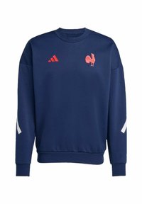 Marineblauwe sweatshirt met een ronde halslijn, voorzien van een roze hanenlogo en rode Adidas-strepen op de borst en witte accenten op de mouwen.