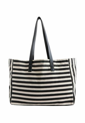 Borsa a tracolla a righe in nero e crema con due manici neri, progettata per versatilità e uso quotidiano.