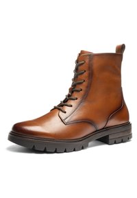 Brun læderankelstøvle med sorte snørebånd, trækflig og tyk slidstærk sål, vist i en let sidevinkel på en hvid baggrund.