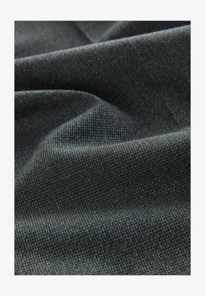 Textured fabric in dark gray, displaying a subtle woven pattern. The surface appears soft with some draping, creating gentle folds.