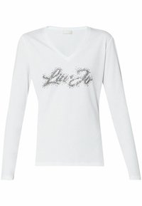 White long-sleeve V-neck shirt featuring a black embellished print design. The fabric appears smooth and lightweight, ideal for casual wear.
