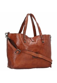 Braune Leder-Shopper-Tasche mit doppelten Griffen und einem verstellbaren Schultergurt. Merkmale sind metallische Nieten und eine strukturierte Oberfläche.