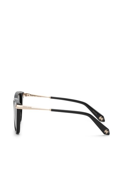 Lunettes de soleil noires avec branches en métal doré et embouts en plastique noir, avec un logo et le nom du créateur sur les branches.