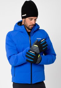 Blue insulated jacket with a hood, paired with black gloves featuring bright blue and green accents, made from soft, durable materials.