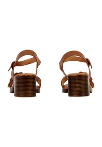 Braune Leder-High-Heelsandalen mit einem gerippten Holzabsatz und mehreren verstellbaren Riemen, die über den Fuß und Knöchel verlaufen.