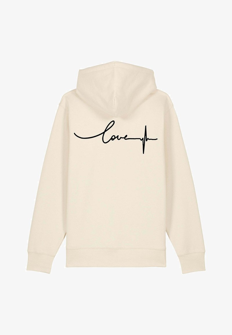 Krémová mikina s kapucňou s čiernym kurzívnym textom "love" a dizajnom srdcového tepu na zadnej strane. Mäkko tkaná látka, kapucňa so šnúrkou a rebrované manžety.