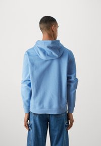 Tommy Jeans FLAG HOODIE - Hanorac - westside blue