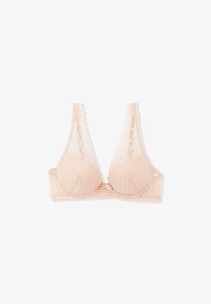 Reggiseno in pizzo rosa chiaro con motivi floreali, bordi smerlati e un piccolo fiocco centrale, mostrato disteso su sfondo bianco.