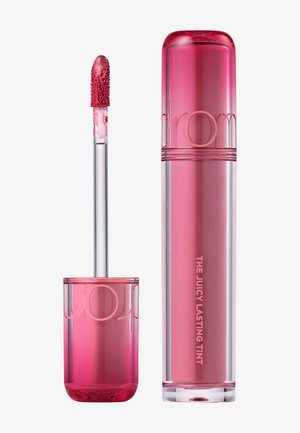 Pink lip tint in a transparent tube with matching applicator wand showing dense textured tip with product coating.