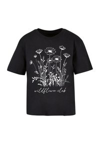T-shirt noir à manches courtes avec un motif floral blanc et le texte "wildflower club" en écriture cursive.