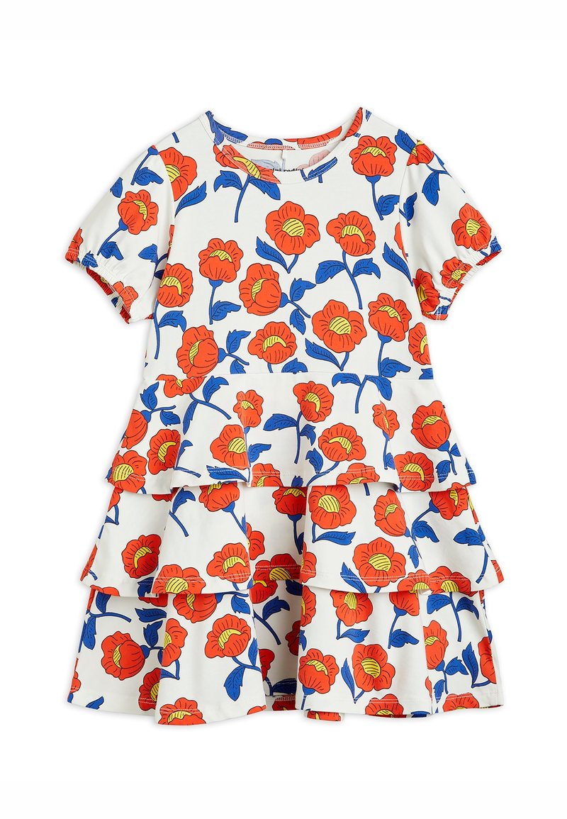 Robe blanche à manches courtes avec jupe à volants présentant des fleurs orange vif aux centres jaunes et des feuilles bleues sur tout le tissu.