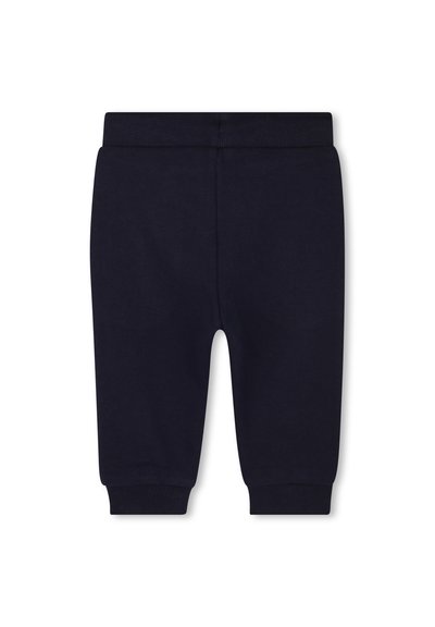 Marineblauwe katoenen joggingbroek met een elastische tailleband, taps toelopende pijpen en een gladde textuur, met een eenvoudig, effen ontwerp.