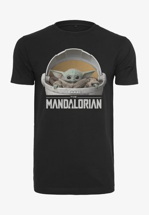Schwarzes Baumwoll-T-Shirt mit einem grafischen Motiv eines grünen Charakters in einer Kapsel, darunter in fetten weißen Buchstaben der Text "DAS MANDALORIAN".