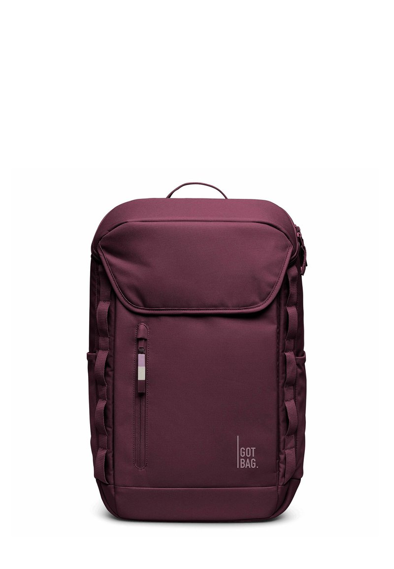 Zaino rettangolare di colore viola scuro con tasca anteriore con zip, maniglia superiore, anelli laterali e logo "GOT BAG" nell'angolo in basso a destra.
