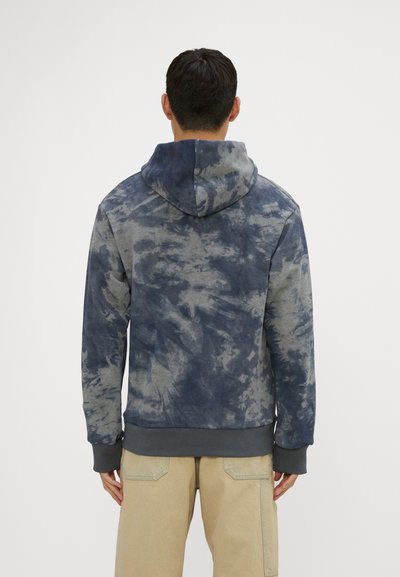 Hooded sweatshirt with a tie-dye pattern in blue and gray. Features ribbed cuffs and hem. Shown from the back with a relaxed fit.