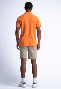 Petrol Industries MEANDER - Pikeepaita - blazing orange