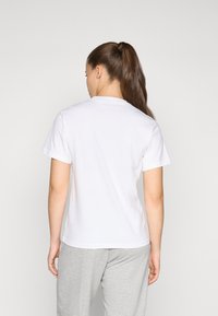 adidas Sportswear Nyomott mintás póló - white