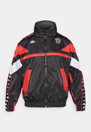 Black windbreaker jacket with red and white accents, high collar, zip closure, elastic cuffs, and Kappa logo on chest and sleeves.