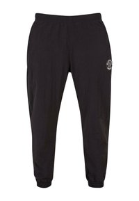 Pantaloni sport cu talie elastică, cu glezne strânse și buzunare laterale. Au un logo circular pe coapsa stângă.