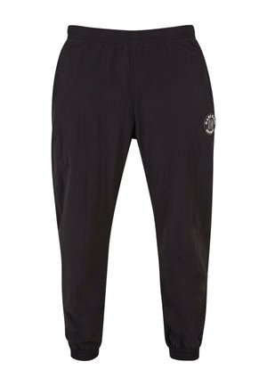 Black joggers with an elastic waistband, cuffed ankles, and side pockets. Features a circular logo patch on the left thigh.